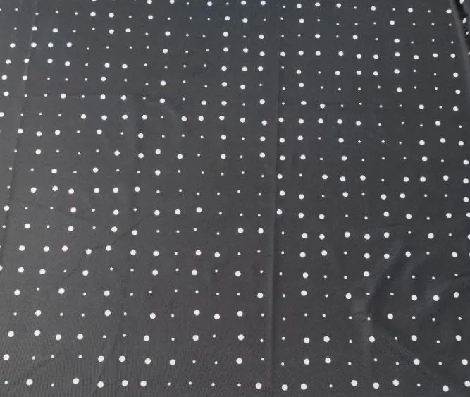 Partial view of ScanCloth scanning surface showing integrated fiducial markers on fabric